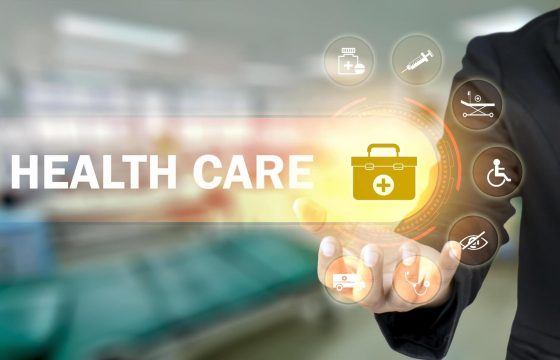 businessman-holding-icons-with-medical-symbols-on-blurry-background-health-insurance-concept-health-care-and-health-insurance-business-free-photo