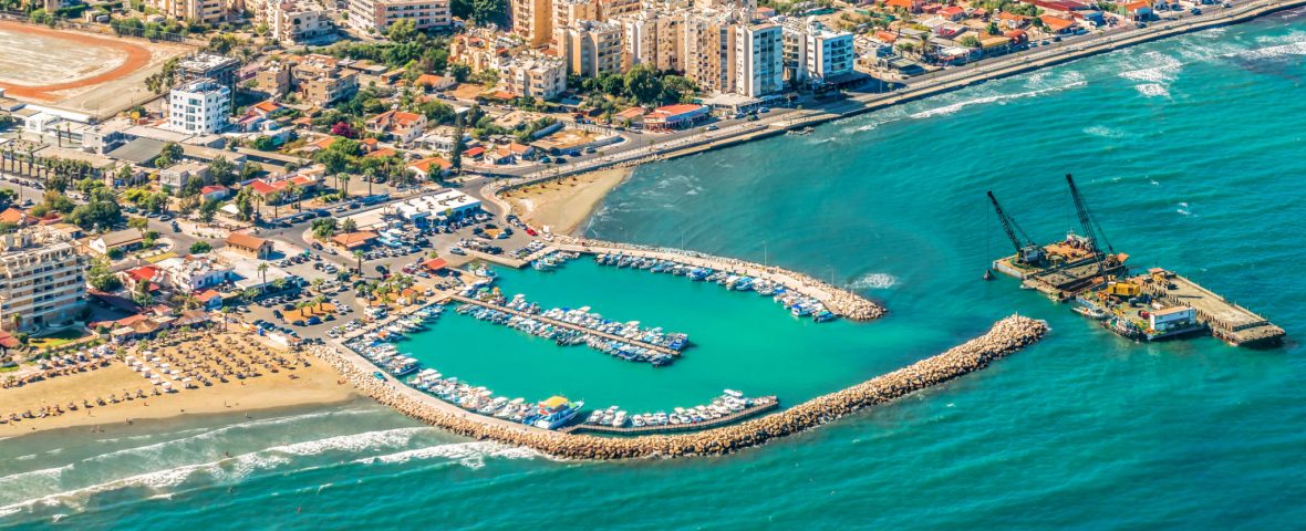 Sea port city of Larnaca, Cyprus.  View from the aircraft to the coastline, beaches, seaport and the architecture of the city of  Larnaca.